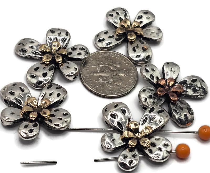 The flower-shaped design adds a delicate and timeless element to your jewelry, making them perfect for bracelets, necklaces, and earrings.