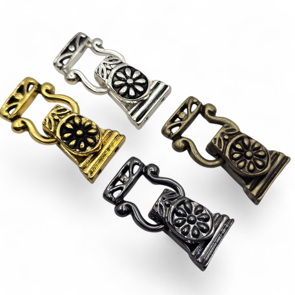 Mixed 2-hole fold-over magnetic clasps for jewelry making in silver, gold, antique brass, and dark silver finishes. This four-piece floral clasp assortment features two attachment holes on each end for double-strand bracelets and multi-strand jewelry designs. Decorative magnetic bracelet clasps combine easy magnetic alignment with a hinged fold-over closure. Ideal jewelry findings for beaded bracelets, bead weaving, handmade jewelry, DIY bracelet making, and jewelry making at home.