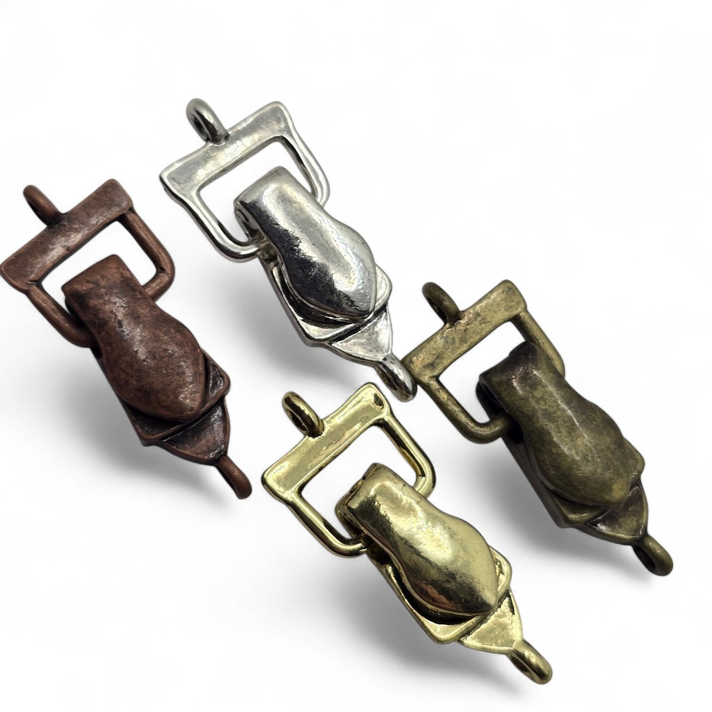 Mixed metal single-loop fold-over magnetic clasps for jewelry making in silver, gold, antique brass, and antique copper finishes. This four-piece assortment features the same smooth clasp design in four versatile metal colors. Each magnetic bracelet clasp has one attachment loop on each end for connecting beading wire or other jewelry materials. Decorative jewelry findings for handmade bracelets, necklaces, beaded jewelry, DIY bracelet making, and jewelry making at home.