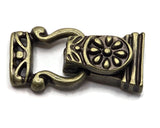 These antique brass fold-over bracelet clasps offer jewelry makers a beautiful alternative to ordinary closures. An intricate floral design decorates the top while darker antiquing brings out the pattern and creates vintage character. Measuring approximately 27.6 mm long, these magnetic clasps have two stringing holes on each end for double-strand bracelet designs. They coordinate beautifully with rustic, western, bohemian, Victorian-inspired, and nature-themed jewelry using gemstones, glass beads, seed bea