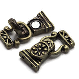 Create vintage-inspired handmade jewelry with these antique brass 2 hole magnetic bracelet clasps. The floral design features raised brass-colored details accented by darker recessed areas for added dimension and an aged appearance. Each clasp has two attachment holes on both ends, making it ideal for double-strand bracelets and other multi-strand jewelry designs. Pair these decorative jewelry clasps with gemstone beads, Czech glass, crystals, seed beads, pearls, or western-style beads for a beautiful finis
