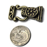 Finish your DIY bracelet design with an ornate antique brass magnetic clasp featuring a detailed floral pattern. These larger fold-over clasps are designed with two holes on each end, allowing jewelry makers to create double-strand and multi-strand bracelets with a polished transition into the closure. The warm antique brass plating works beautifully with turquoise-style beads, gemstones, crystals, seed beads, and earth-tone designs. An attractive jewelry finding for vintage, western, boho, and handmade jew