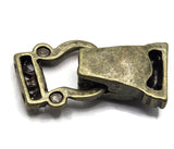 An antique bronze metal clasp, likely for jewelry making or crafting, shown on a plain white background.