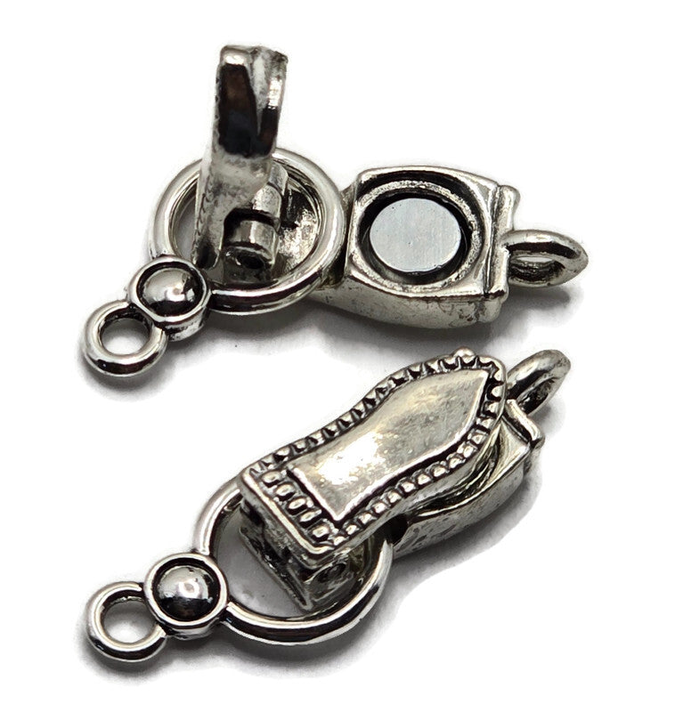 These Weathered Silver fold-over magnetic clasps feature a darker silver finish similar to stainless steel, with irregular antiqued detailing that creates a softly aged appearance. Each clasp measures approximately 29 mm long and 10 mm wide with one loop on each end. The magnetic closure and fold-over design make these bracelet clasps easy to use. Perfect for bead weaving, DIY bracelets, necklaces, gemstone jewelry, seed beads, and handmade jewelry designs.