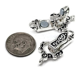 Bright silver magnetic fold over clasp with decorative black enamel accents and intricate scroll designs. Photographed open and closed to highlight the magnetic closure system and hinged construction. This single-strand bracelet clasp includes attachment loops on each end, making it ideal for beading wire jewelry, handmade bracelets, artisan accessories, jewelry findings, and custom bracelet designs.