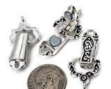 Bright silver fold over magnetic bracelet clasp with ornate decorative details and black enamel accents. The hinged closure folds over a magnetic base to create a secure and easy-to-use bracelet finding. Featuring a single loop on each end, this clasp works beautifully in handmade bracelets, custom jewelry designs, artisan accessories, beading projects, and leather jewelry creations.