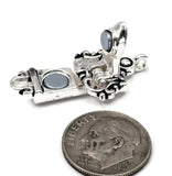 Elegant magnetic fold over clasp featuring decorative silver scrollwork highlighted by black enamel accents. Displayed in open and closed positions, the clasp showcases its hinged construction and magnetic closure system. Designed for single-strand jewelry with one loop at each end, it is ideal for bracelet making, jewelry findings, artisan beadwork, and handcrafted accessories.