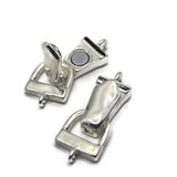 Silver fold over magnetic clasps photographed to demonstrate how the hinged clasp folds over and locks into place using a strong magnetic connection. The sleek bright silver finish complements a wide variety of jewelry styles. Perfect for bracelet making, beading wire designs, leather bracelets, artisan jewelry projects, jewelry findings, and handmade accessories requiring convenient and secure bracelet closures.