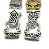 Decorative fold-over magnetic bracelet clasp assortment featuring four different 2-hole styles in mixed silver and gold metal finishes. Each jewelry clasp has two holes on both ends for attaching double strands of beads, beading wire, or other jewelry-making materials. These magnetic clasps feature detailed floral and geometric designs with a secure hinged fold-over closure, making them attractive jewelry findings for handmade bracelets, necklaces, bead weaving, and multi-strand jewelry projects.