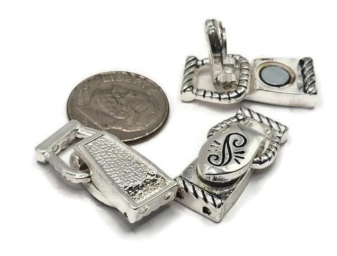 Silver fold over magnetic clasps with rope‑edge style. Each clasp has a cutout on one side to house knots or crimps and 2 holes on each end for double‑strand stringing. Ideal bracelet clasps for bead weaving, peyote bands, and necklace clasps for gemstone strands. Secure, easy magnetic closure for jewelry making, jewelry clasps, and DIY components.