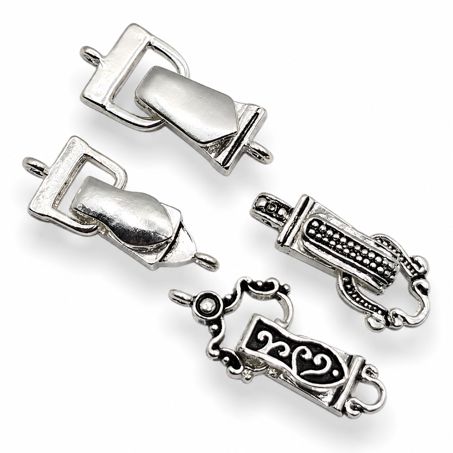 These bright silver fold-over magnetic clasps offer a secure and attractive closure option for handmade jewelry designs. Featuring a single-loop attachment on each end, they are ideal for bracelets, necklaces, and other single-strand projects. The fold-over cover helps reinforce the magnetic closure while maintaining a sleek appearance. Their polished silver finish coordinates beautifully with beads, chain, gemstones, and other jewelry making components.