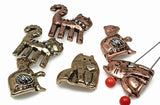 These playful cat 2-hole slider beads add whimsical charm to your jewelry creations. Made in antique bronze and copper finishes, each bead features sweet details like a raised heart, yarn ball, or collar. The dual-hole design keeps cords flat and secure, making them perfect for bracelets, chokers, and artisan necklaces. Ideal for pet lover gifts, boho jewelry, and rustic handmade designs.
