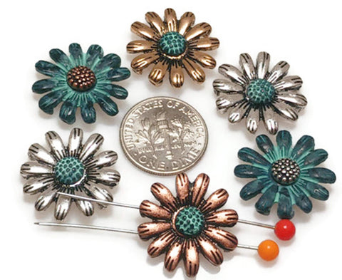 These daisy sliders bring cheerful, botanical flair to double‑strand bracelets. The domed petals and oxidized shadows create depth without bulk. Mix silver, copper, and patina finishes for boho bouquets, or spotlight one bloom as a focal slider on a choker. Great components for festival jewelry, teacher gifts, and nature‑inspired sets.