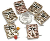 These dragonfly slider beads are perfect for nature-inspired jewelry. Rectangular in shape, each bead features a raised silver-tone dragonfly set against a textured background in warm bronze and copper finishes. Their 2-hole slider design ensures strands stay flat and secure, making them ideal for chokers, necklaces, and bracelets. Perfect for boho jewelry, artisan gifts, or symbolic handmade accessories celebrating transformation.