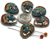 These artisan sea turtle slider beads feature multi-tone antique silver, bronze, and copper finishes accented with turquoise, gold, and red for a coastal vibe. With detailed turtles set against a beach-inspired background, each 2-hole bead is perfect for nautical and boho jewelry designs. The dual-hole construction makes them a great fit for wide bracelets, chokers, or handmade necklaces with a beachy, ocean-lover feel.