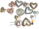 These rustic heart 2-hole slider beads are perfect for romantic and boho jewelry creations. Designed in antique silver, copper, and bronze finishes, each bead features charming heart styles, including open, layered, and solid designs. With sturdy 2-hole construction, they stay flat and secure in chokers, bracelets, and necklaces. Ideal for artisan jewelry, Valentine’s gifts, and symbolic handmade designs celebrating love.