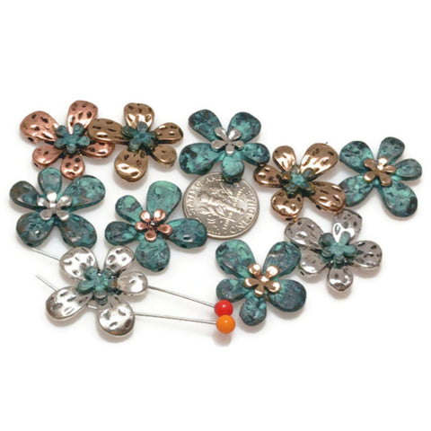 Our floral slider 2-hole beads in mixed metals are perfect for adding a delicate botanical touch to your handmade jewelry designs.
