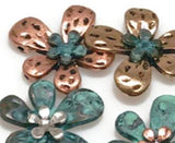 Whether you prefer a patina finish for a rustic look or gold and silver for a classic aesthetic, these floral two-hole slider beads are a must-have for jewelry makers.