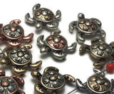 Crafted in gold, silver, and copper, these turtle beads bring a beautiful mix of warm and cool metals to your designs.