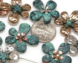 These two-hole metal beads are designed to slide easily onto beading wire, making them perfect for bracelet stacks and statement necklaces.