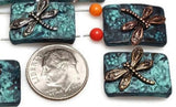 The gold or silver dragonflies on top of the patina background are intricately detailed, bringing a delicate touch of nature into your jewelry.