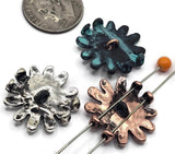 Antique‑finished daisy blooms with crisp petal detail and textured centers. Use these 2‑hole slider beads as focal sliders, strand separators, or pendant connectors across bracelets, chokers, and anklets. The verdigris option adds a pop of teal that pairs perfectly with beachy palettes and bohemian stacks.