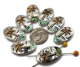 These tropical slider beads are perfect for creating beach-inspired jewelry. Crafted with a two-hole design, they feature a golden palm tree and abalone-style sea inlay, set against a silver-toned base. Ideal for making nautical bracelets, chokers, or anklets that stay secure and stylish. Perfect for jewelry makers, Etsy shops, and artisan crafters creating ocean-inspired designs.