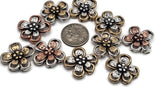 These detailed floral beads are perfect for multi-strand bracelets and cord jewelry. Their two-hole slider design allows for stability and easy placement in your creations. A great supply for boho and feminine looks.