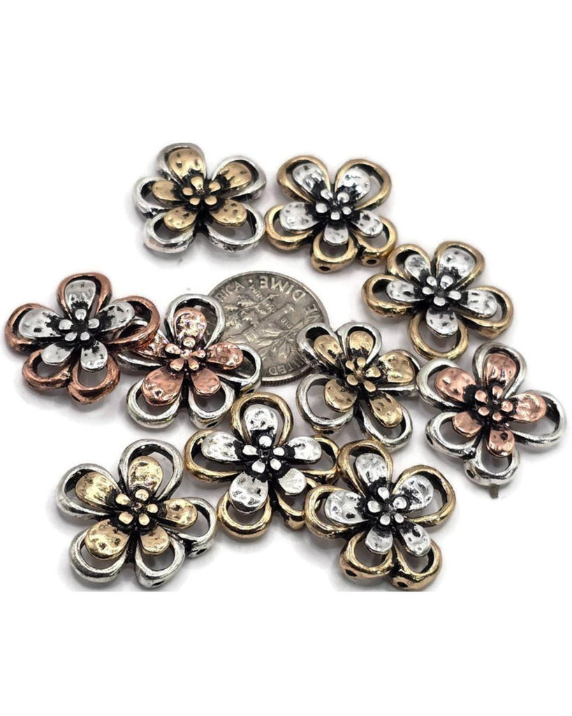 Bring elegance to your jewelry designs with these two-hole flower slider beads. Featuring silver petals accented with gold, bronze, or copper details, they’re ideal for creating unique bracelets, necklaces, and anklets.