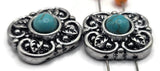 These western turquoise 2 hole slider beads feature a decorative floral design with antique silver metal and turquoise colored center stones. Designed as metal slide spacer beads for double strand bracelet and necklace jewelry making, they pair beautifully with seed beads, duo beads, gemstone beads, or leather cords. Perfect for cowgirl jewelry, southwestern bracelet designs, boho jewelry projects, and handmade DIY beading supplies.