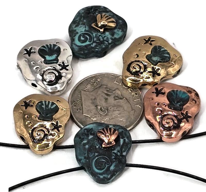 These seashell 2-hole slider beads bring seaside beauty to jewelry designs. Crafted in antique silver, gold, copper, and turquoise patina, each bead features raised seashell, starfish, and spiral shell motifs. Perfect for ocean, coastal, and nautical jewelry, these beads symbolize the sea’s tranquility and charm. Their two-hole design makes them stable for bracelets, necklaces, and boho accessories. Great for beach lovers and artisan makers.
