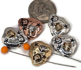 Celebrate seaside style with these pebble‑shaped seashell beads. Each bead highlights a detailed raised shell, spiral accents, and tiny stars, finished in antique copper, brass, and silver. Dual‑hole construction keeps them aligned, ideal for bracelet focals or necklace pendants. Lightweight yet durable, they’re artisan supplies perfect for nautical jewelry, summer gifts, or boho designs inspired by the ocean.