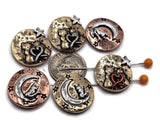 This collection showcases round 2 hole slider beads with enchanting celestial themes — some featuring cats perched beneath the moon and stars, while others depict two cats intertwined around a heart in the night sky. Crafted from durable metal in mixed finishes of gold, bronze, copper, and silver accents, these beads blend romance and magic, making them perfect focal beads for handmade jewelry designs.