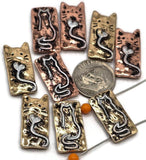 Cute rectangular 2 hole slider beads featuring whimsical cats with heart tails. Finished in silver with pops of red and gold, these metal beads add playful charm to handmade bracelets and pendants.