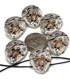These metal 2 hole slider beads feature sea turtle motifs in bronze against bright silver. Designed to lay flat in jewelry, they’re ideal for focal beads, spacer beads, and bead findings in nautical or seaside inspired bracelets and necklaces.