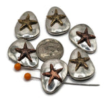 Bring seaside elegance into your projects with these starfish slider beads. Each oval-shaped bead has a textured gold or copper starfish on a polished silver backdrop, making them unique statement pieces. With a dual-hole slider design, they stay flat and stable in bracelets, necklaces, and multi-strand chokers. Perfect for boho, coastal, and summer jewelry designs, these beads capture the natural beauty of the ocean while offering durability and versatility for artisans and hobbyists alike.