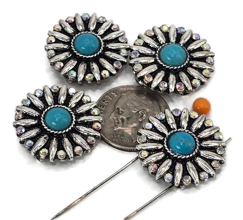 These round 2 hole slider beads feature a radiant floral burst design highlighted by a turquoise cabochon center and halo of rainbow rhinestones. Their two-hole construction ensures stability and flat placement in your jewelry projects, perfect for bracelets, chokers, and pendants. Measuring close to a dime in size, they make dramatic focal beads or decorative accents in bohemian, Southwestern, and festival-inspired jewelry.