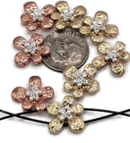 These flower 2 hole slider beads feature hammered metal petals in gold and copper tones, highlighted with silver accents at the center. Their two-hole design ensures secure, flat fitting in bracelets, chokers, and necklaces. Great as focal beads or decorative spacers, they’re perfect for artisans crafting boho, romantic, or garden-inspired jewelry with elegance and durability.