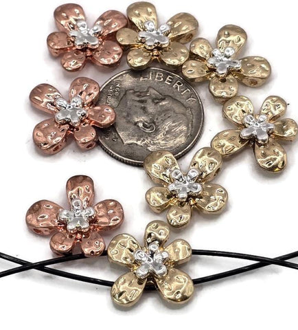 These flower 2 hole slider beads feature hammered metal petals in gold and copper tones, highlighted with silver accents at the center. Their two-hole design ensures secure, flat fitting in bracelets, chokers, and necklaces. Great as focal beads or decorative spacers, they’re perfect for artisans crafting boho, romantic, or garden-inspired jewelry with elegance and durability.