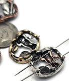 Celebrate cats and cosmic charm with these oval slider beads. Featuring a raised sitting cat and crescent moon design, these beads come in antique silver, bronze, and copper finishes. The dual-hole slider construction ensures stability and balance for chokers, bracelets, and artisan necklaces. Perfect for boho jewelry, symbolic accessories, or handmade gifts for cat lovers who appreciate whimsical, mystical designs.