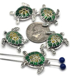 These sea turtle slider beads are perfect for coastal-inspired jewelry designs. Each bead features a silver-tone frame with a vibrant green and yellow enameled shell, capturing the beauty of the ocean. The dual 2-hole slider construction ensures strands remain flat and secure, making them ideal for chokers, bracelets, and necklaces. Perfect for boho artisans, nautical jewelry, and handmade gifts for beach lovers.