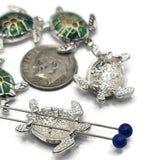 These colorful sea turtle 2-hole slider beads bring coastal charm to handmade jewelry. Featuring silver-tone detailing with vibrant green and yellow enameled shells, they capture the beauty of the ocean. The dual-hole slider design keeps cords flat and secure, making them perfect for chokers, bracelets, and necklaces. Ideal for nautical jewelry, bohemian accessories, and thoughtful handmade gifts for turtle lovers.