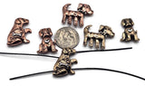 Add rustic personality to your designs with these dog-shaped slider beads. Crafted in copper and bronze tones with raised motifs like hearts and bones, each bead carries whimsical charm. The 2-hole slider construction holds cords and wires flat, ensuring stability in artisan jewelry. Great for boho bracelets, chokers, or pet memorial keepsakes, these beads make wonderful handmade gifts for dog lovers.