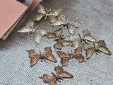 These butterfly two‑hole slider beads combine symbolic artistry with functionality. Featuring filigree wing details in antique copper, brass, and silver finishes, they add lightness and natural elegance to designs. The dual‑hole construction ensures secure placement in necklaces, chokers, or bracelets. Lightweight yet durable, these sliders are perfect for jewelry makers seeking unique, meaningful components with bohemian and artisan style.