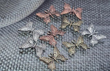 Soar into artisan jewelry making with these two‑hole butterfly beads. Featuring openwork filigree designs, they’re available in finishes of antique silver, copper, and brass. These beads offer both symbolic beauty and practical structure, with dual holes that align perfectly in double‑strand projects. Ideal as focal sliders or links, they make standout components for boho, vintage, and nature‑inspired creations.