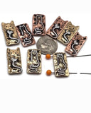 Rectangular cat 2 hole slider beads in silver-tone metal with gold and red accent tails shaped into hearts. These playful beads make perfect focal beads for handmade bracelets, pendants, and DIY necklaces.