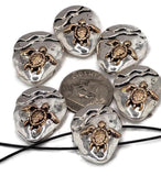 Nautical-inspired 2 hole turtle beads with silver-tone base and bronze turtle detail. Perfect focal beads for handmade ocean jewelry, beach accessories, pendants, and DIY bracelet designs. Great jewelry findings for marine and coastal themes.
