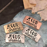These “Fur Mama” slider beads are the perfect focal components for jewelry made with love. Featuring paw print accents and raised lettering across antique silver, copper, and brass finishes, they symbolize devotion to pets. The two‑hole construction ensures stability in multi‑strand designs, making them ideal for bracelets and chokers. Beautiful artisan supplies for animal‑themed jewelry, keepsakes, or pet lover gifts.