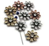 These daisy two‑hole slider beads bring charm and inspiration to handmade creations. Crafted in antique brass, silver, and copper finishes, each flower is etched with positive words and accented with a rhinestone center. The dual‑hole design makes them great for structured bracelets, chokers, or necklaces. Perfect as artisan focal components for boho, spiritual, or meaningful inspirational jewelry pieces.