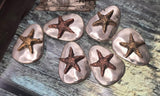 These starfish slider beads are stunning artisan focals for handmade jewelry. The silver stone‑like base highlights raised bronze starfish, lending a rustic yet coastal charm. Two‑hole construction ensures stability, making them perfect for structured bracelets or statement pendant necklaces. Add them to beach‑themed, bohemian, or nautical artisan collections for unique jewelry that celebrates the sea with style and craftsmanship.